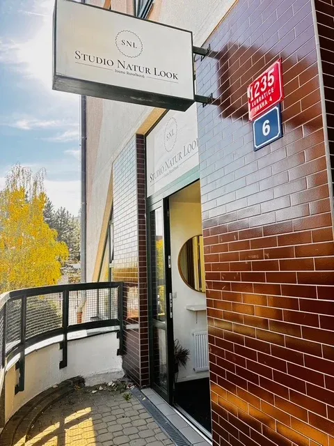 The entrance to Studio Natur Look — the sign above the door and house number 1235, Prague 4 – Kunratice